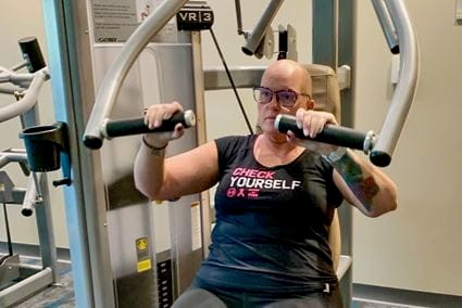 woman using exercise equipment